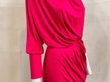 the mannequin is wearing a bright pink dress with a cow neck