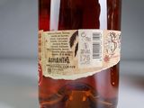 a bottle of alcohol sitting on a table with a label on it