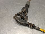 a metal object with a yellow handle on a table