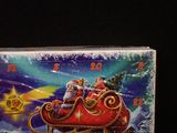 a clock with a santa clause riding in a sleigh