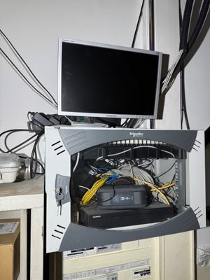 a computer that is sitting on top of a cabinet
