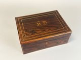 an image of a wooden box that has a crown on it