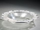 a glass bowl that is sitting on a table