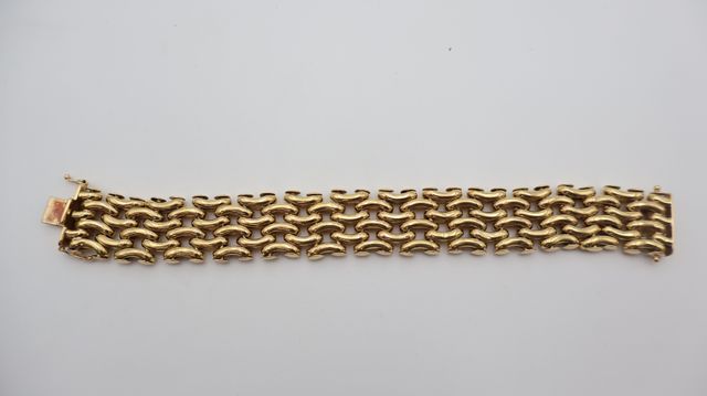 Bracelet en or jaune 18 carats 750 millièmes maille grain de riz....