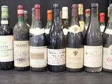 several bottles of wine are lined up on a table