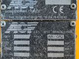 a close up of two signs on the side of a yellow truck