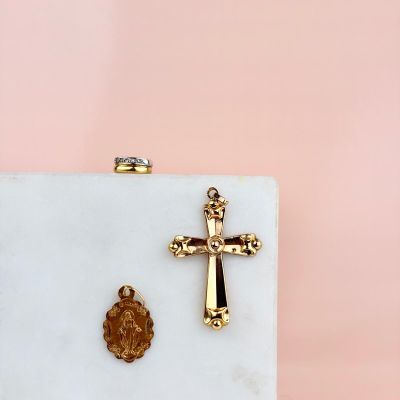 a white marble box with a gold cross and a wax seal on it