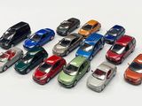 a lot of toy cars that are on a white surface