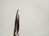 a pair of scissors that are on a table