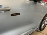a close up of a car door with a sticker on it
