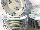 many plates stacked on top of each other on a table