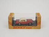 dinky toys red car with beige roof in a box