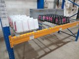 many bottles of water on a shelf in a warehouse