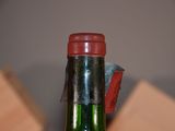 a bottle of wine that is sitting on a table