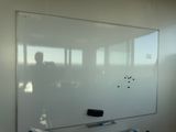 a white board on the wall in a room