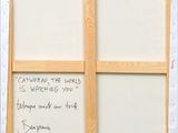 a picture of a picture on the wall with writing on it