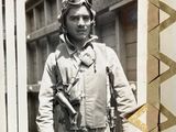 a black and white photo of a man in a pilot ' s uniform