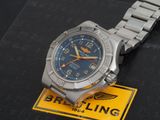 the watch has a blue dial on it and is on a metal bracelet