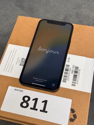 an iphone is sitting on top of a box on a table