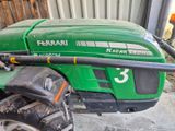 a close up of a tractor with a hose attached to it