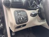 a car dashboard with a control panel and a steering wheel