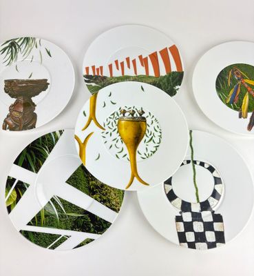 many plates with different designs on them on the wall