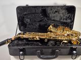 a saxophone that is sitting in a case on a table