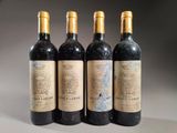 three bottles of wine are lined up on a table