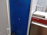 a blue door in the middle of a kitchen