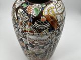a vase that has a picture of a bird on it