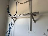 a picture of a wall mounted rack with wires and wires