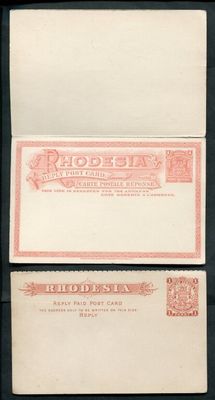 two envelopes with a red and white design on them