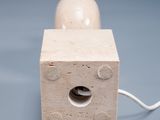 a small wooden object with a hole in the middle of it