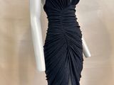 an image of a mannequin dressed in a black dress