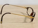glasses on a wooden table with a white wall in the background