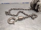 a chain with a hook attached to it on a table