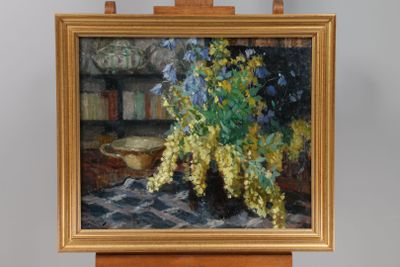 a painting of flowers in a vase on a easel