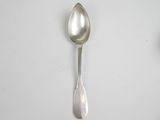 a spoon and a spoon rest on a table