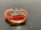 a small glass object that is on a table