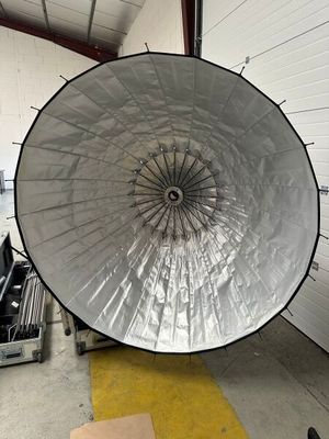 a large white umbrella in the middle of a room