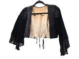 black jacket with fringes on a hanger on a white background
