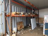 a room that has a lot of shelves and boxes in it