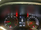 a close up of a car dashboard with various gauges