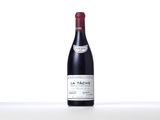 a bottle of red wine sitting on top of a table