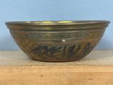 a bowl that is sitting on top of a wooden table