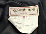a label on a black jacket that says yves saint laurent