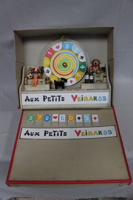 a box with a clock inside of it on a table