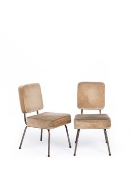 pair of mid - century style chairs with upholstered cushions