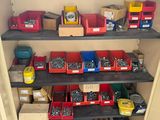 many boxes and bins of tools on the shelves