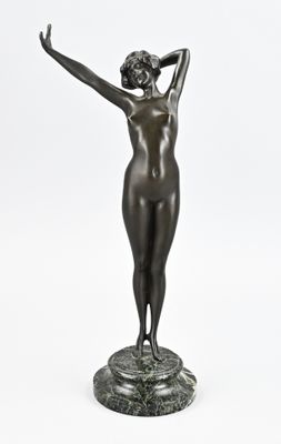 an image of a statue of a woman holding her hands up
